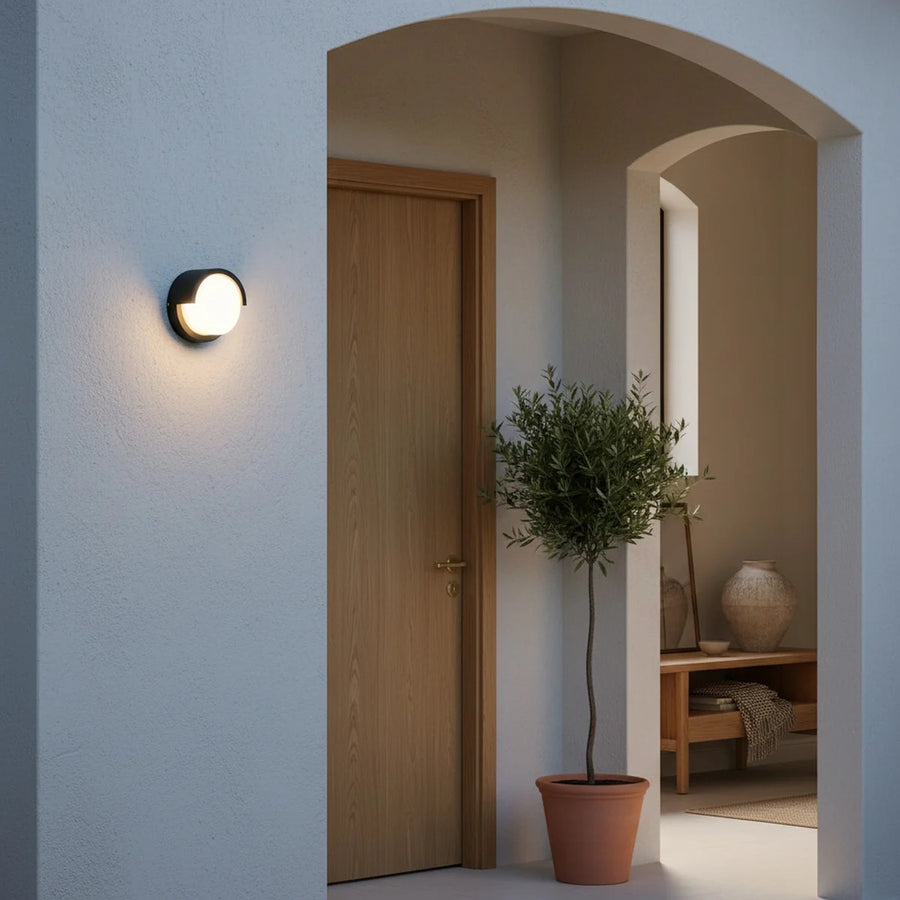 Round Black LED Outdoor Wall Light, 6 in, IP65, styled on an exterior wall
