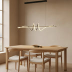 Black Wavy Linear LED Pendant Light, 47", Warm White, styled above a dining table