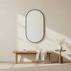 Black Oval Mirror, 20 x 31 in Aluminum Frame, styled in a bright interior