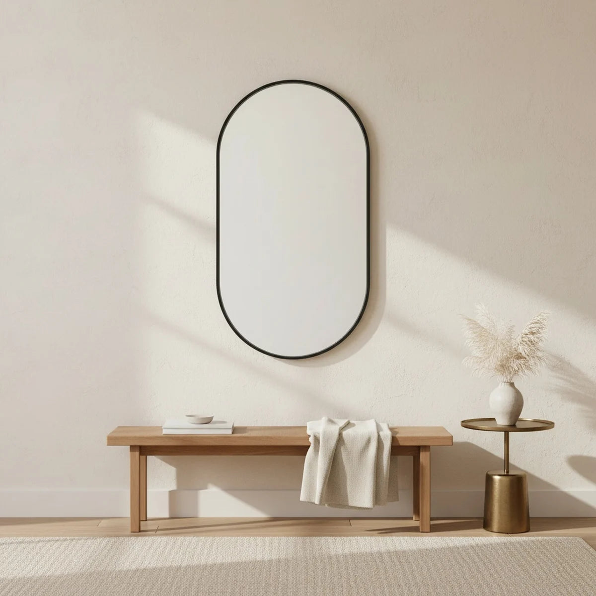 Black Oval Mirror, 20 x 31 in Aluminum Frame, styled in a bright interior