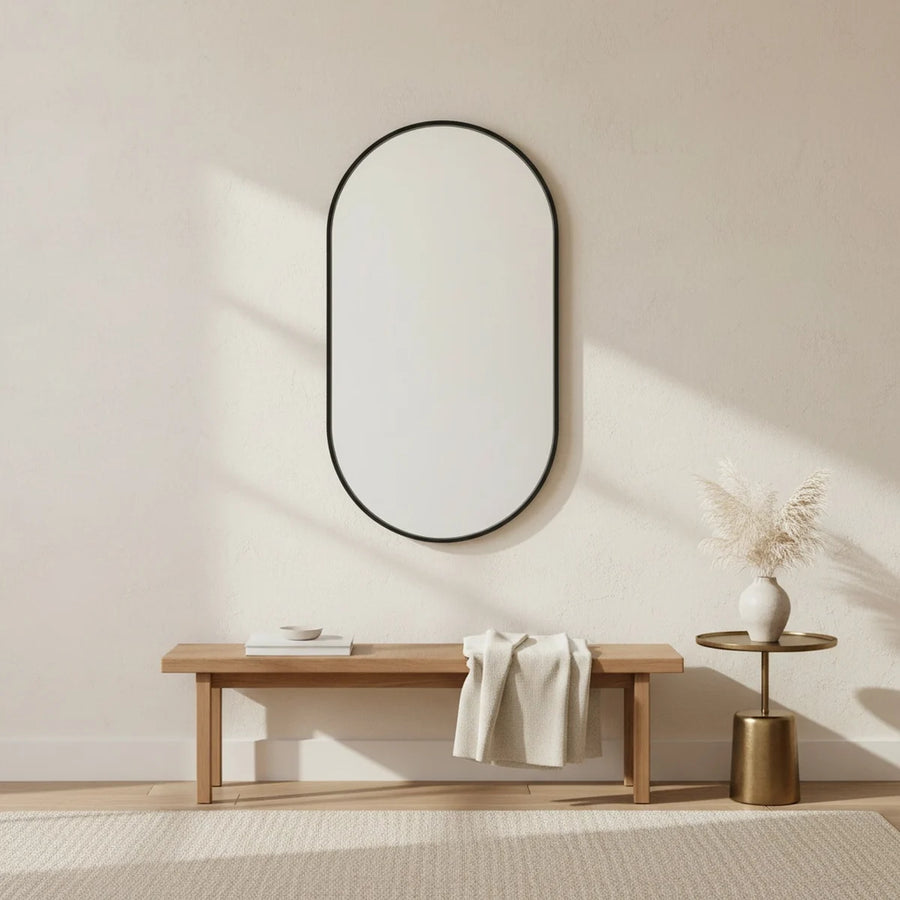 Black Oval Mirror, 20 x 31 in Aluminum Frame, styled in a bright interior