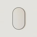 Black Oval Mirror, 20 x 31 in Aluminum Frame, on a light background