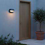 Anthracite Oval Bulkhead Outdoor Light, Ribbed Glass, IP54, styled on an exterior wall