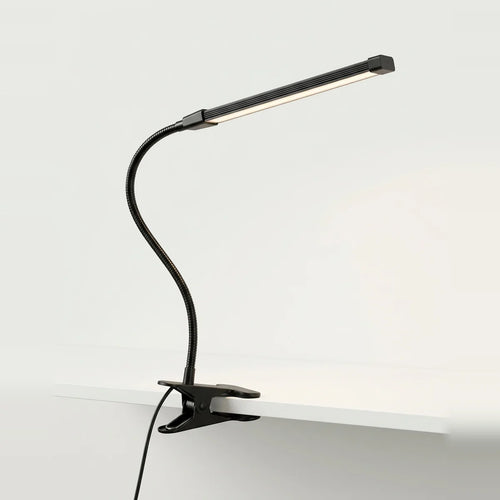 Lampe de chevet à pince LED noire pour lire au lit, photo sur fond clair