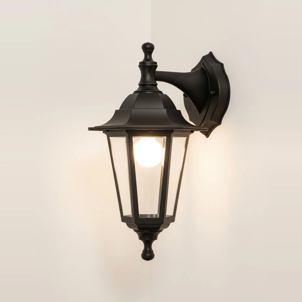 Black Exterior Wall Lantern with Clear Glass, Classic Style, on a light background