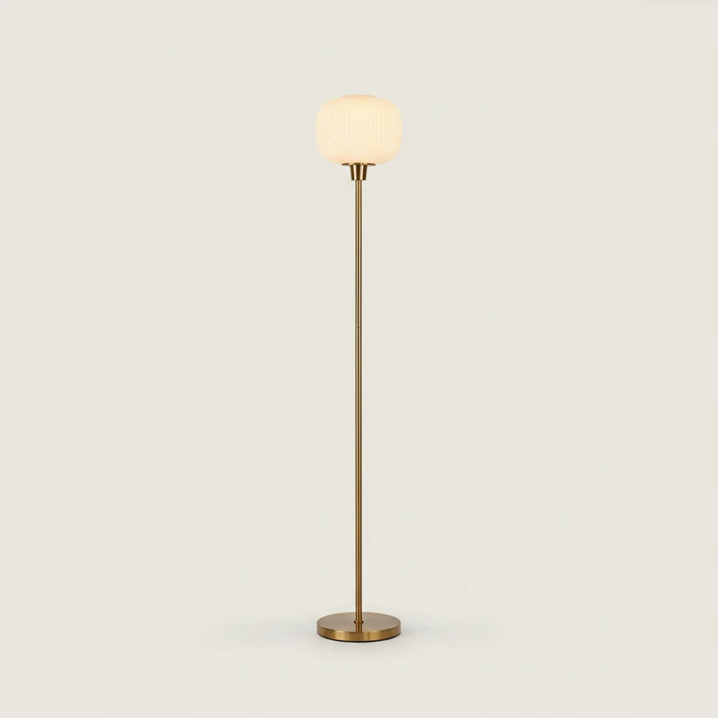 White Opal Glass Globe Floor Lamp, Gold Stem, 63 in, on a light background