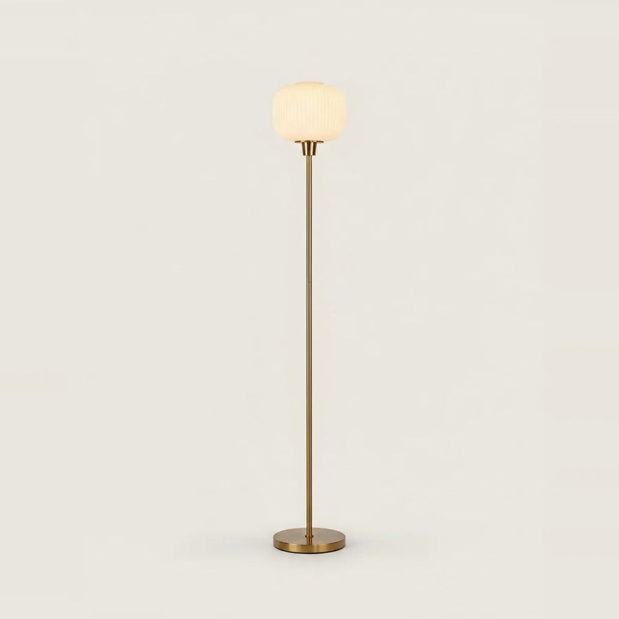 White Opal Glass Globe Floor Lamp, Gold Stem, 63 in, on a light background