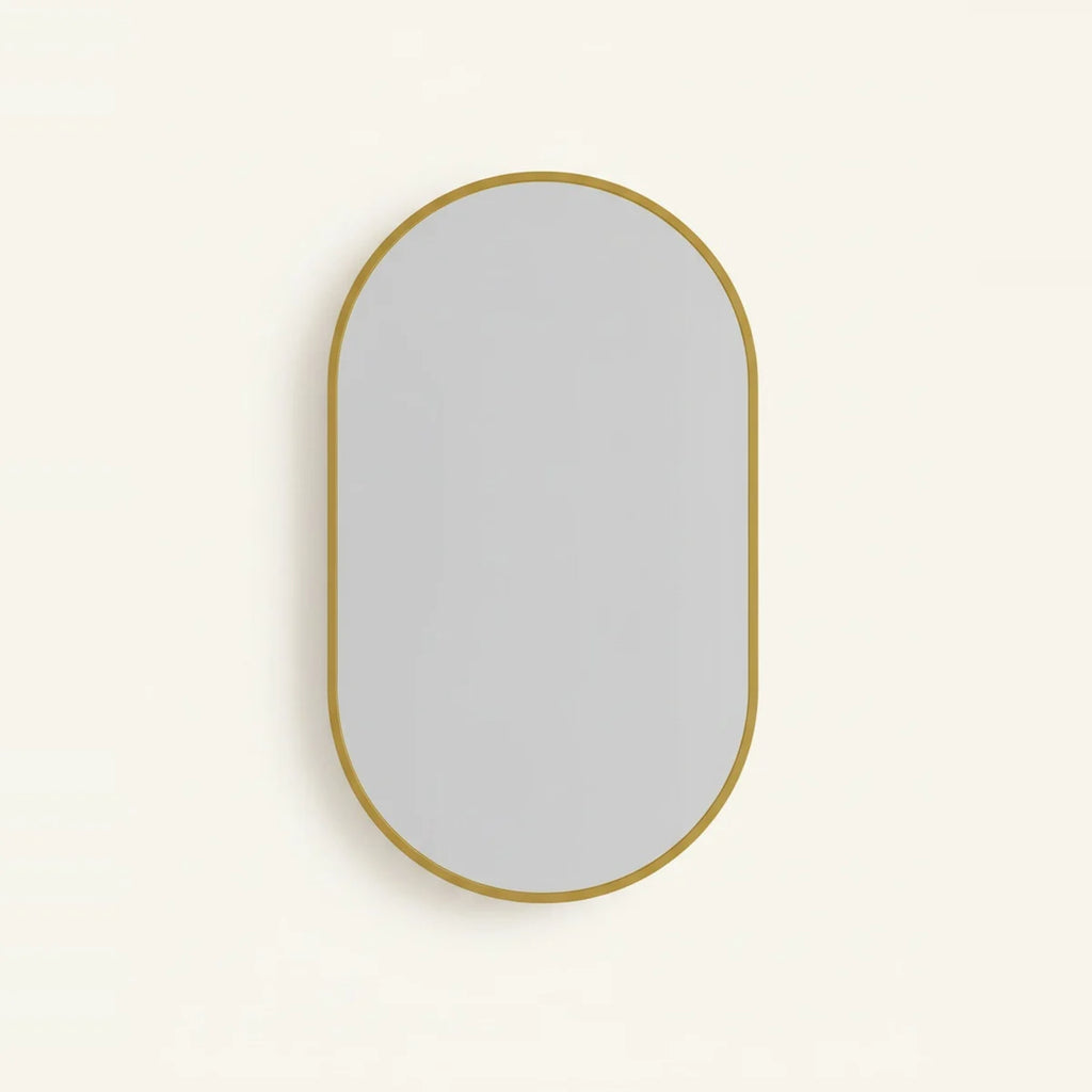 Gold Oval Mirror with Thin Aluminum Frame, on a light background