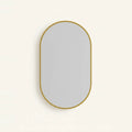 Gold Oval Mirror with Thin Aluminum Frame, on a light background