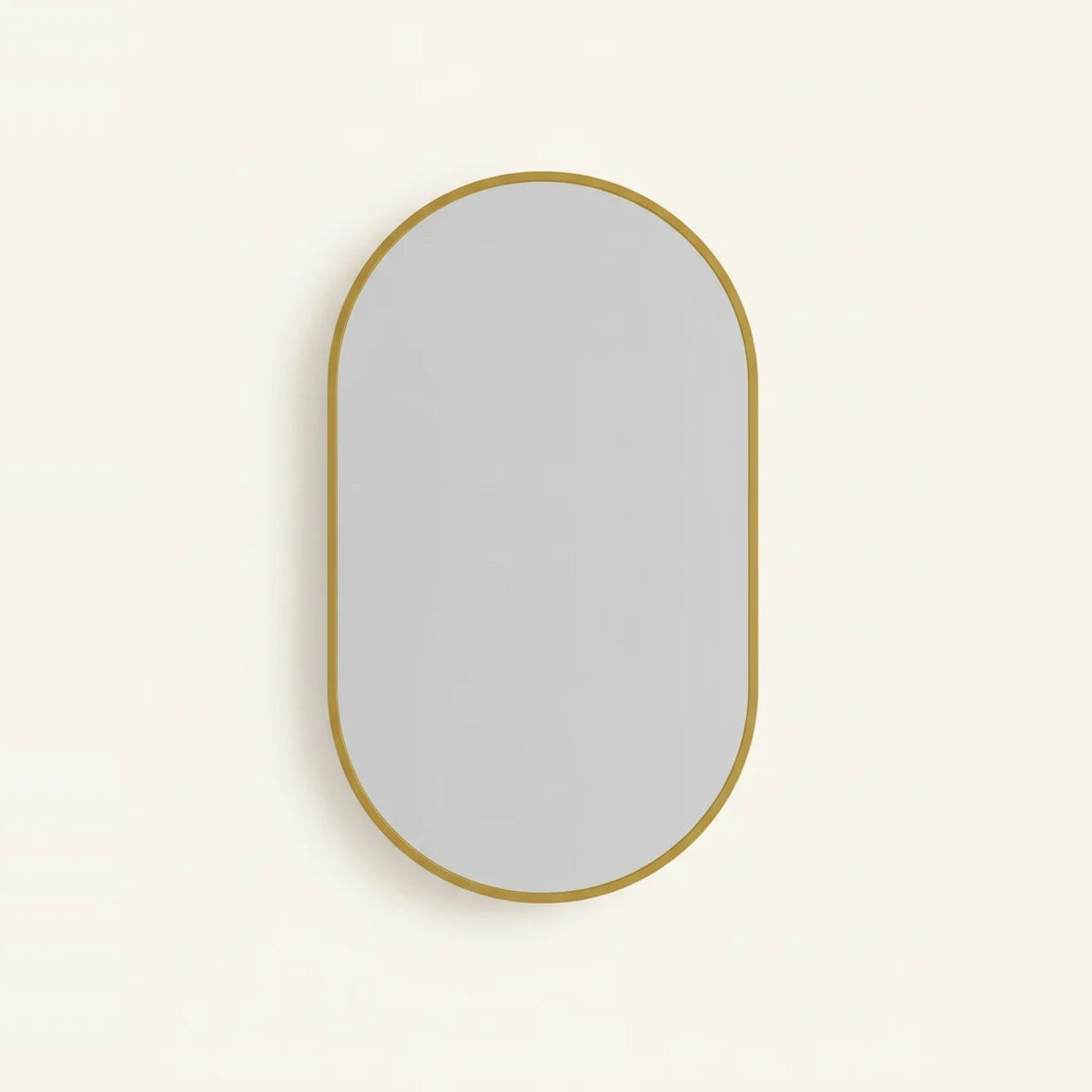 Gold Oval Mirror with Thin Aluminum Frame, on a light background