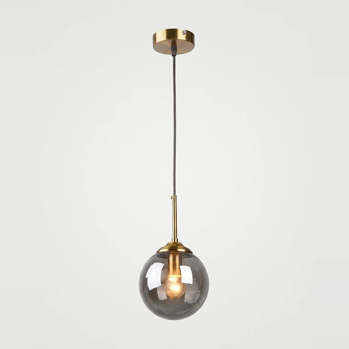 Hanging Bedside Lamp, Smoked Glass Globe, Brass-Look Base, E27, on a light background
