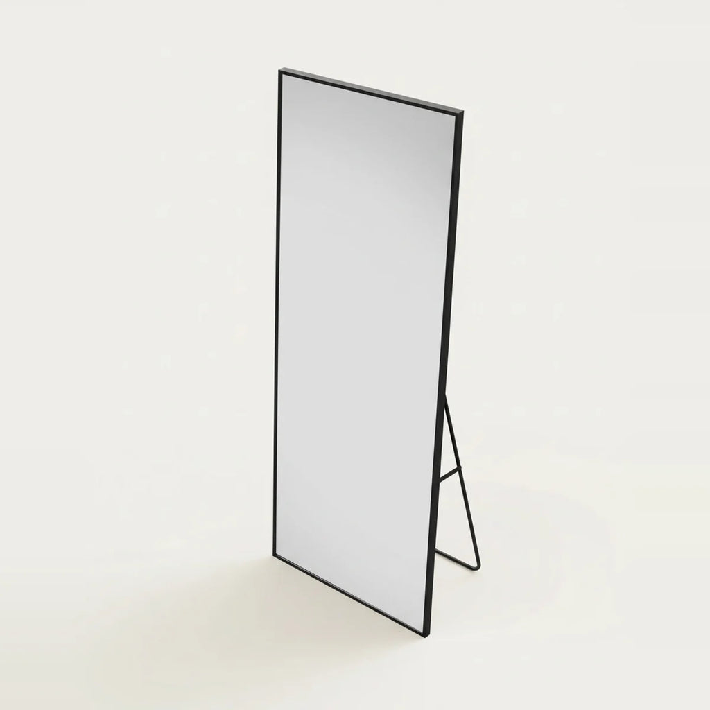 Long Black Mirror, 64.5 × 21 in Aluminum Frame, on a light background