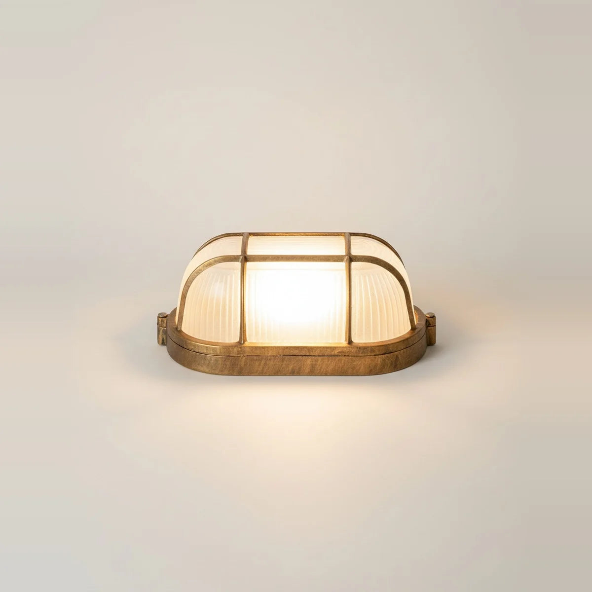 Gold Nautical Outdoor Wall Light, Porthole Style, Aluminum, IP54, on a light background
