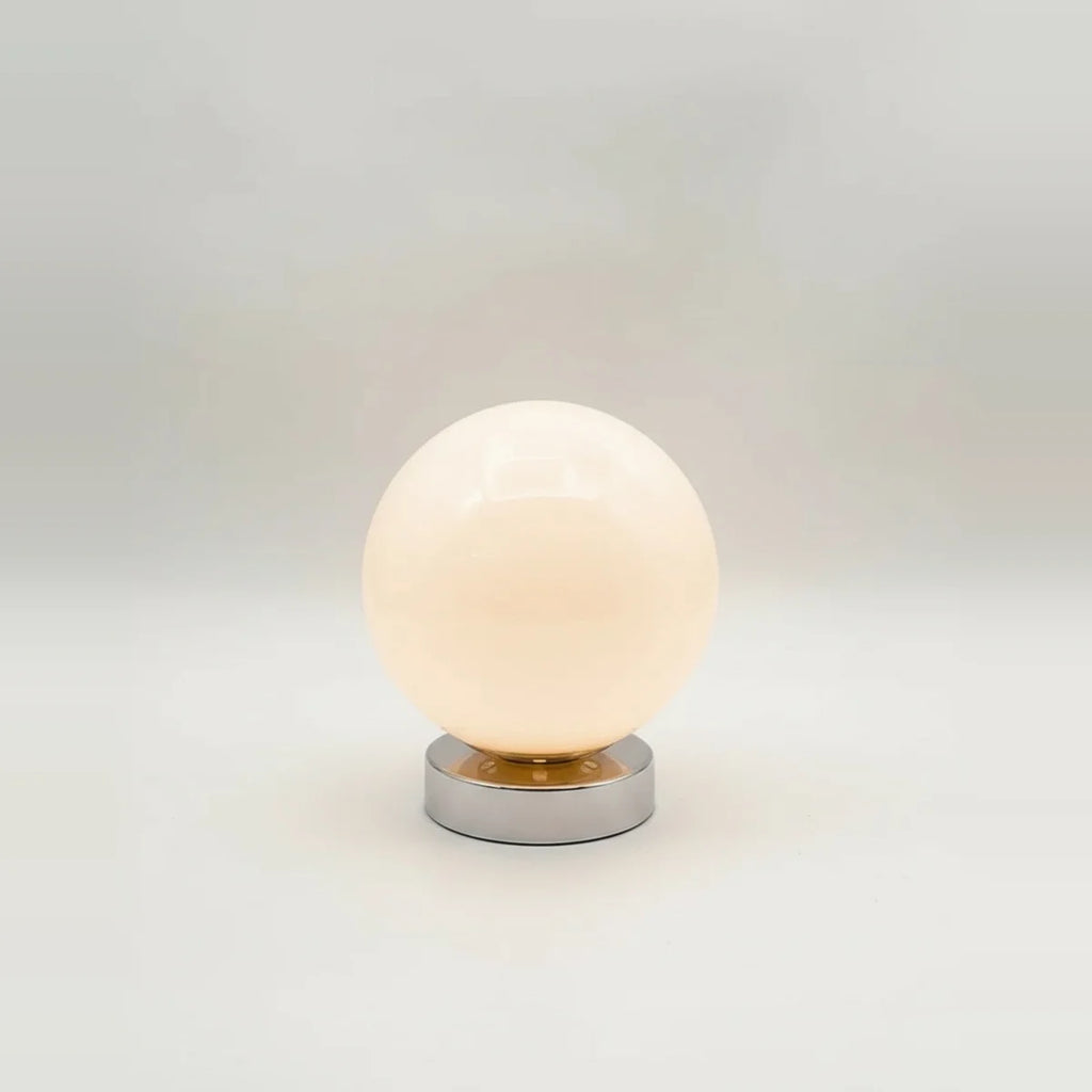Globe Table Lamp, White Opal Glass on a Metal Base, 3 Light Tones, on a light background