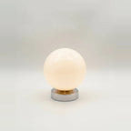 Globe Table Lamp, White Opal Glass on a Metal Base, 3 Light Tones, on a light background