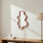 Small Pink Wavy Mirror, styled in a bright interior