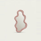 Small Pink Wavy Mirror, on a light background