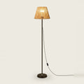 Rattan Floor Lamp with Hand-Woven Shade, Black Base, 55 in, on a light background