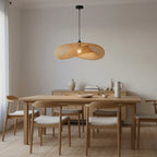 Hand-Woven Rattan Pendant Light, 16", Black Cord, styled above a dining table