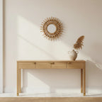 Handwoven Rattan Sun Mirror, styled in a bright interior