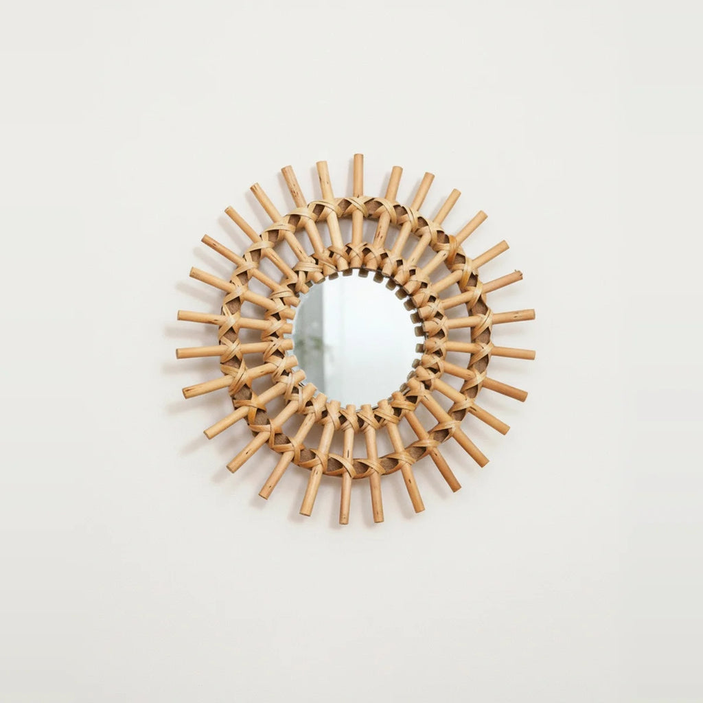 Handwoven Rattan Sun Mirror, on a light background