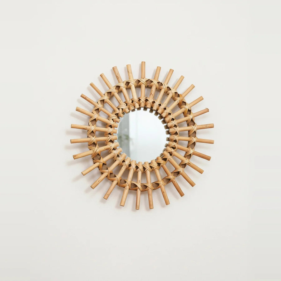 Handwoven Rattan Sun Mirror, on a light background