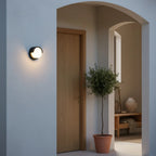 Round Black LED Outdoor Wall Light, 6 in, IP65, styled on an exterior wall