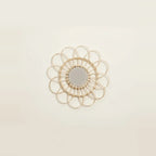 Small Rattan Mirror, Round and Handwoven, on a light background