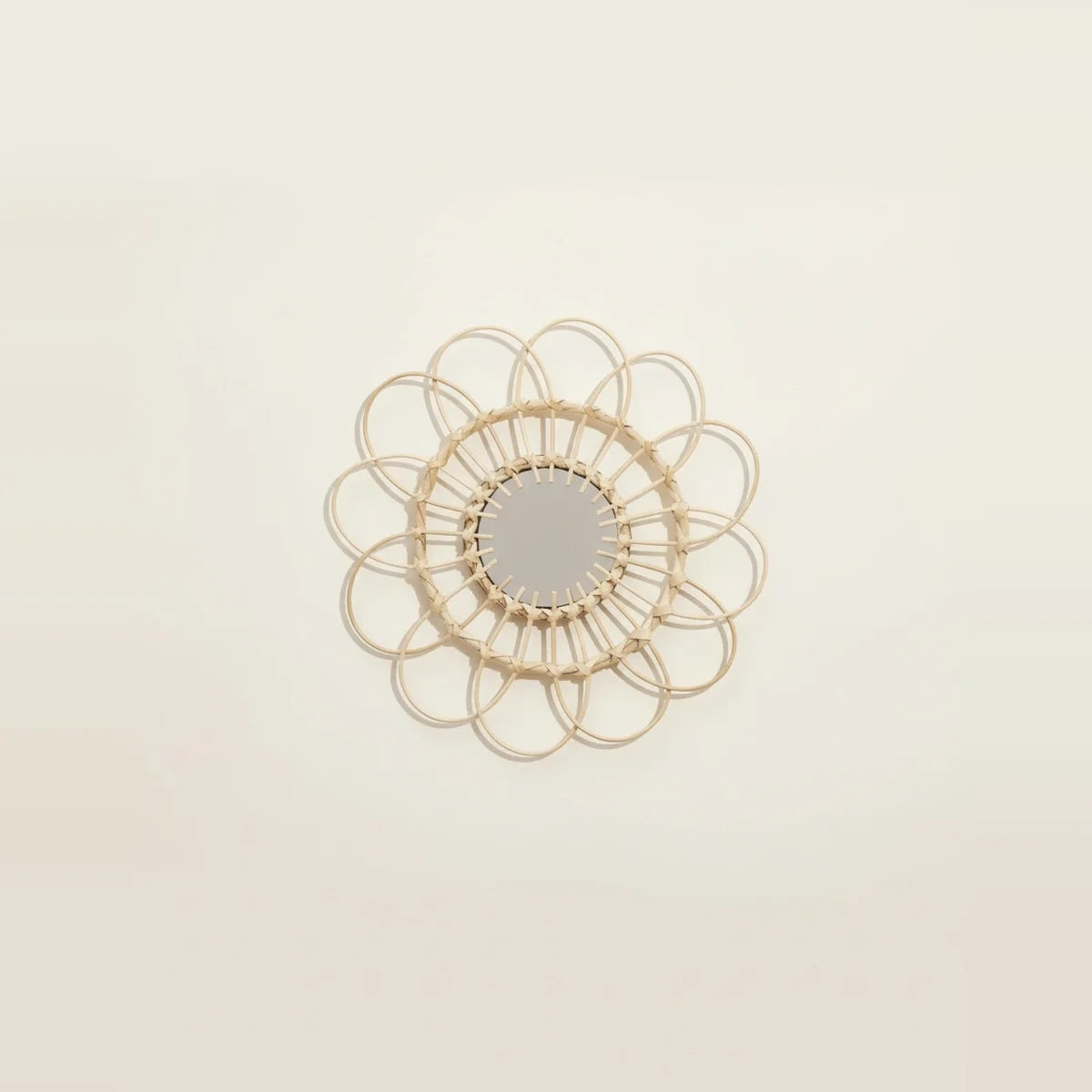 Small Rattan Mirror, Round and Handwoven, on a light background