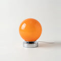 Lampe de chevet vintage en verre orange, esprit années 70, photo sur fond clair