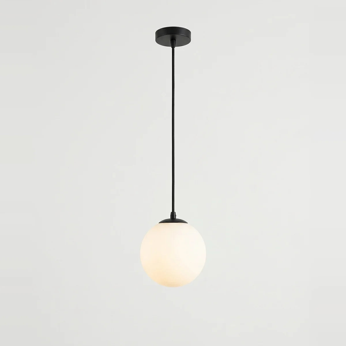 White Glass Pendant Light, Small Globe, 4" to 7" – Ø 4 in (10 cm), on a light background