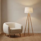 Wooden Tripod Floor Lamp with White Fabric Shade, styled in a living room