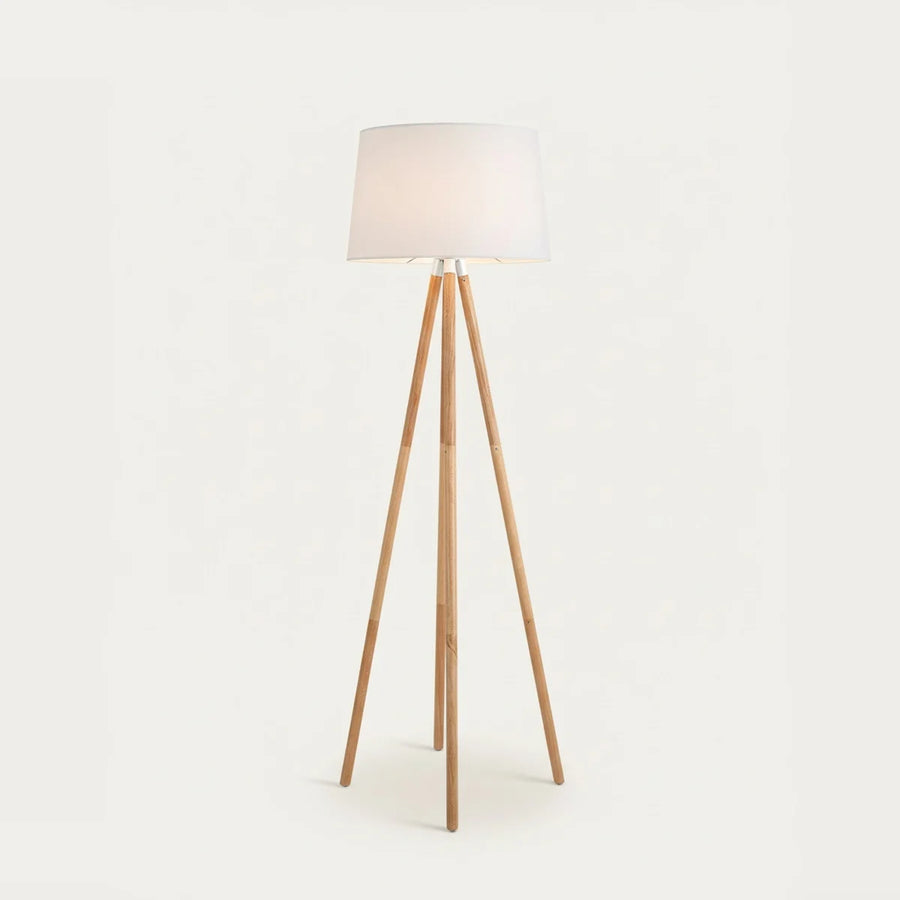 Wooden Tripod Floor Lamp with White Fabric Shade, on a light background